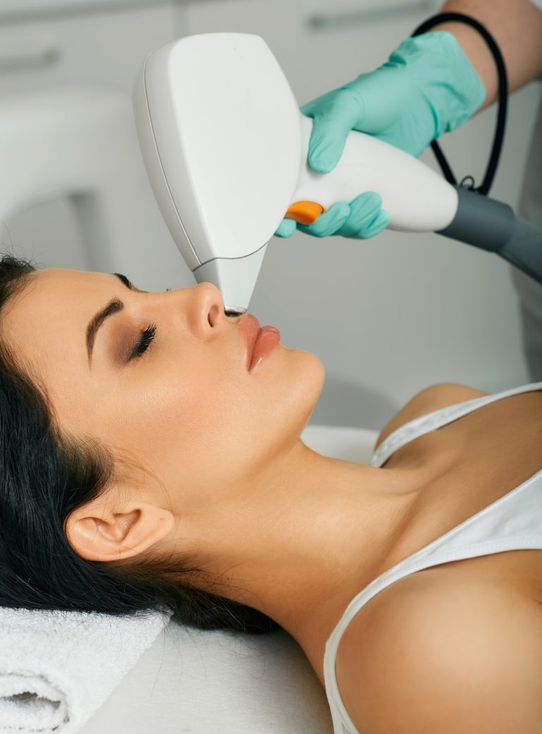 Facial laser hair removal. Beautiful woman during laser hair removal and laser epilation to lips